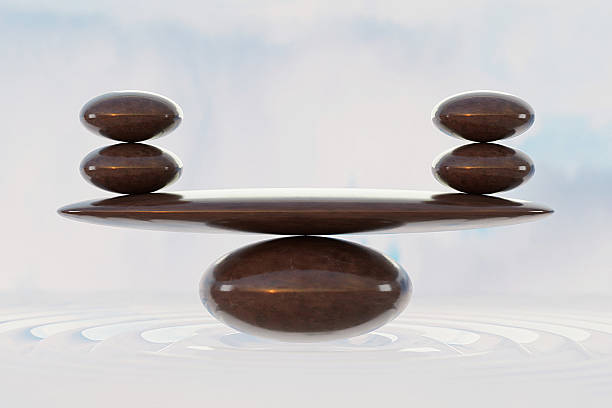 istock stone stacking marble stone sculpture, on rippled water 2232769145