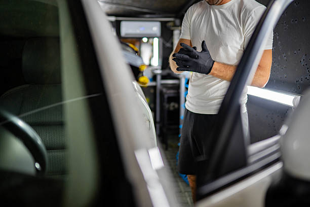 istock Specialist man clean interior in car service 2232769193