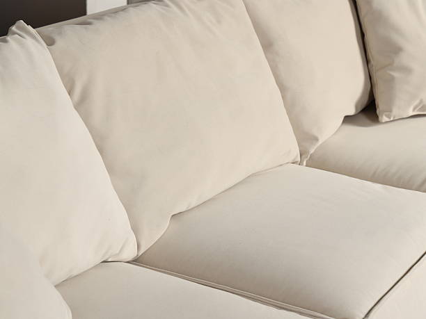 istock Stylish Beige Sofa featuring Plush Cushions and a Modern Design that Enhances Any Space 2232770652