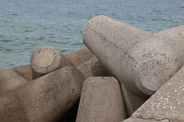 istock Concrete Tetrapods on Seaside Breakwater 2232772148