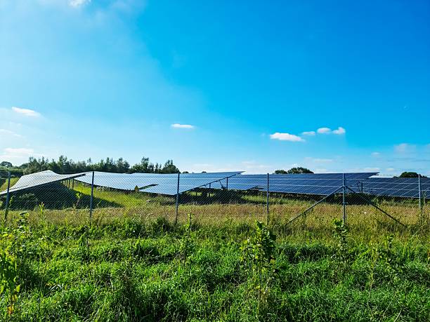 istock Solar panels providing renewable energy under blue sky 2232773326