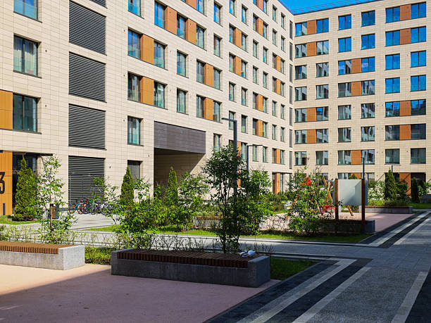 istock A Modern Apartment Complex featuring a lovely Green Courtyard and Innovative Architectural Design 2232774756
