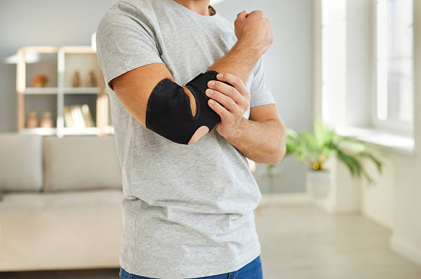 istock Guy with bandage on elbow have injury 2232775555