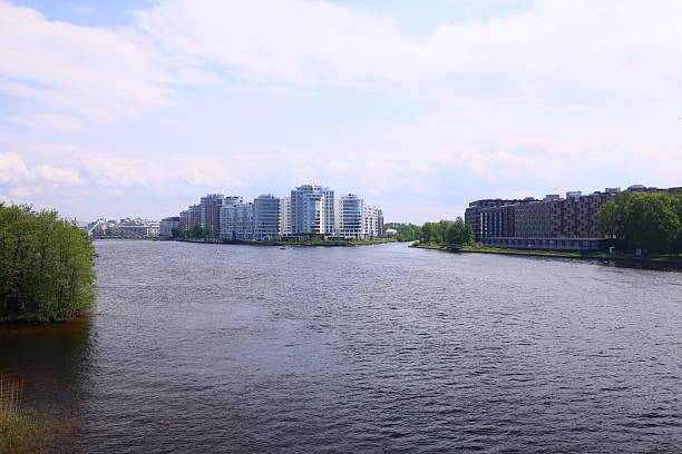 istock A scenic waterfront with modern architecture and lush greenery, forming a beautiful urban landscape 2232775922