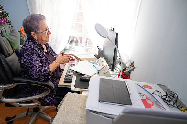 istock Elderly woman preparing cognitive material for remote counseling 2232781182
