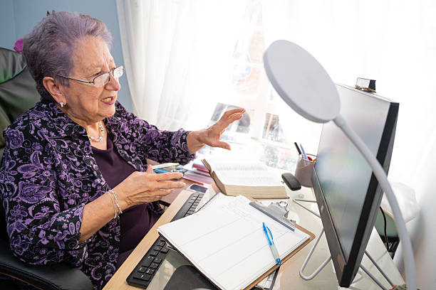 istock Elderly woman preparing cognitive material for remote counseling 2232781234