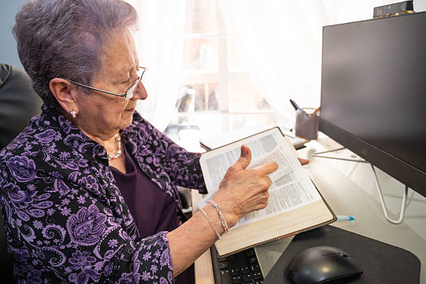istock Senior counselor using religious text for online counseling 2232781662