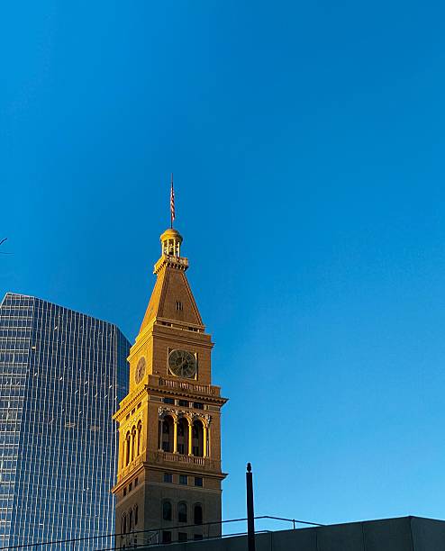 Prior to 1950 the fashionable Daniels and Fisher Department Store was the crown jewel of the Denver skyline for many years until it fell into ruin during the 1950's. Built in 1911 and designed by architect F. G. Sterner, the D & F Tower was the tallest structure west of the Mississippi, at a height of 393 feet. Visitors to the 20th floor used to be able to see 200 miles in any direction. The building is of the Italian Renaissance style and is constructed of brick, stone & terra cotta. In the 1960’s after financial ruin the building was set to be demolished. The flagship store was destroyed but due to immense effort from preservationists in the early 1970’s, its grand clock tower was saved. Now listed on the National Register of Historic Places and a Denver Landmark, The D & F Clock Tower is also a contributing building to the Downtown Denver Historic District. It nightly lights up the Denver skyline and remains one of the most iconic elements of the Denver skyline.