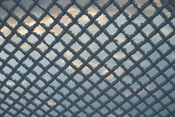 The sky through the grid on a cold winter day..
