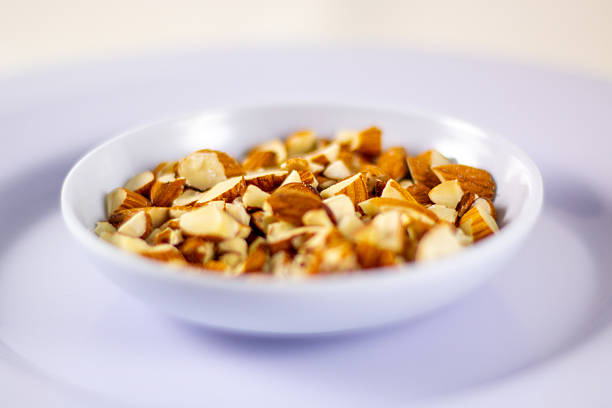 Assortment of nuts on white wood table