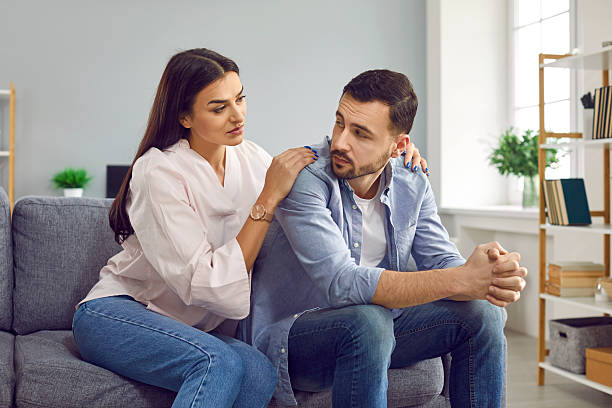 istock Attractive wife hugging husband from back to comfort or apologize 2232798903