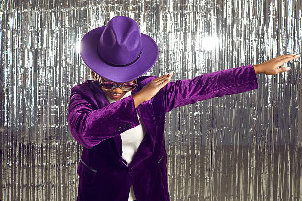 istock Happy black disco girl make dab dance moves 2232800424