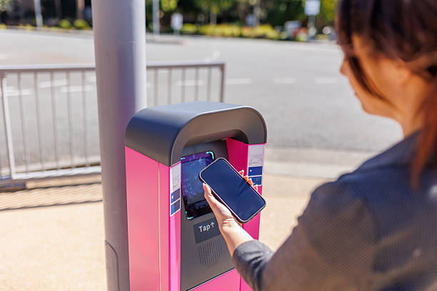 istock Woman using phone to make contactless ticket payment 2232800971