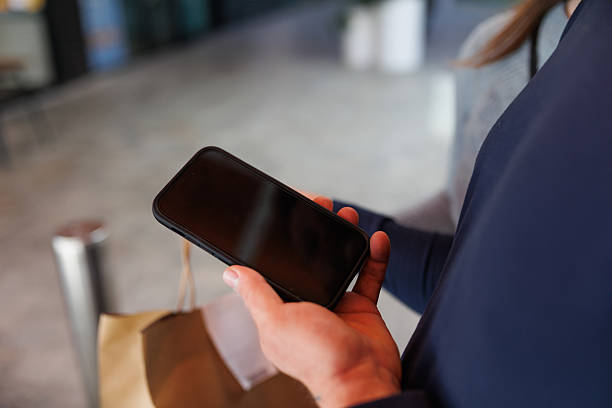 istock Man checking phone after receiving food delivery 2232801218