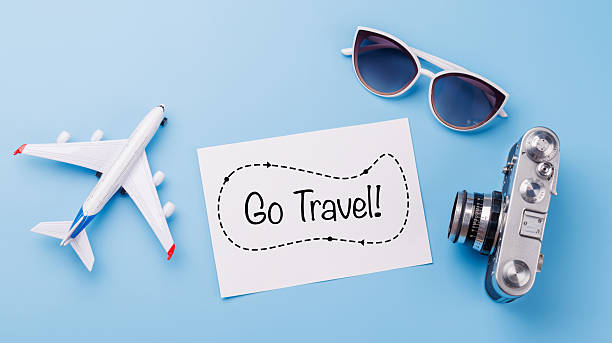 istock Travel-themed flat lay with card, camera, toy airplane 2232808683