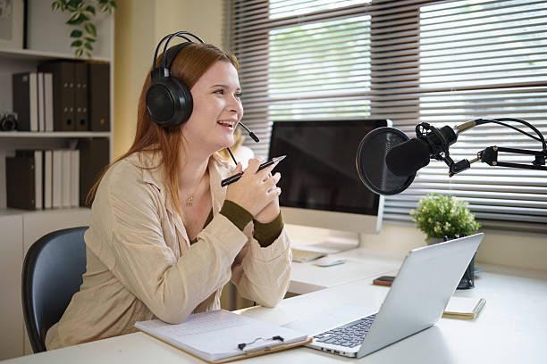 istock Confident host discussing topics for her podcast while streaming in a stylish office. 2232809432
