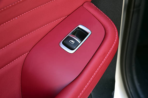 Luxury car parts. Button for one window winder in the car.