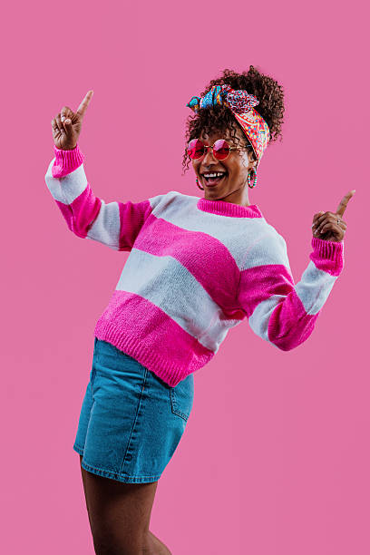 istock Influencer showing and pointing with excitement on pink backgrou 2232811246
