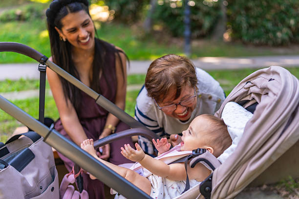 istock Latin family having fun outdoors with baby in stroller 2232812916