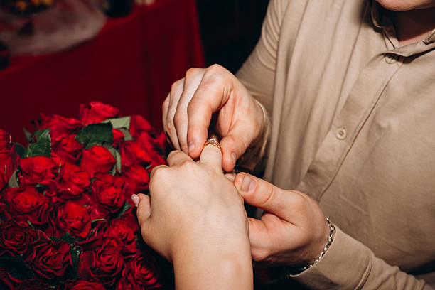 istock Engagement Ring with Red Roses and Romantic Proposal Moment 2232813830