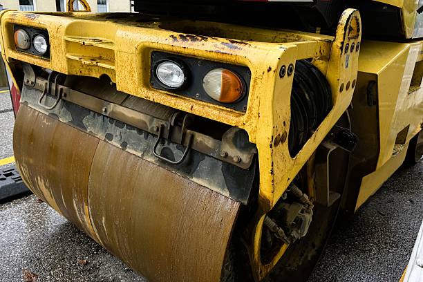 Munich, Bavaria, Germany - August 04, 2025: An industrial road roller designed for efficient asphalt compaction, highlighting its features and functionality on a construction site.