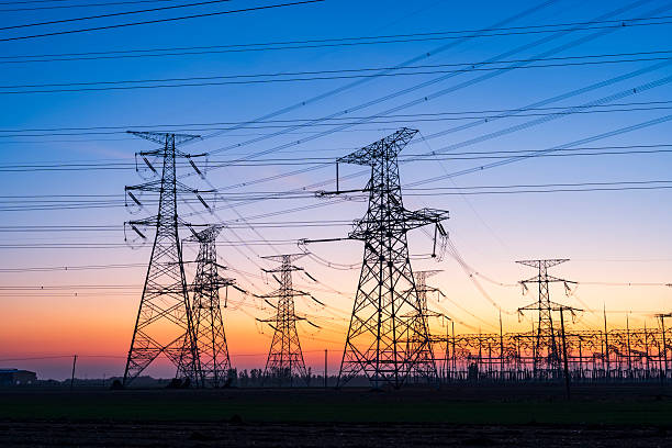 istock Pylons, high voltage pylons in the evening 2232815673