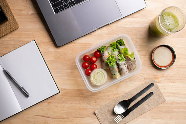istock Top view of Salad Wrap meal prep container on the office desk. 2232816549