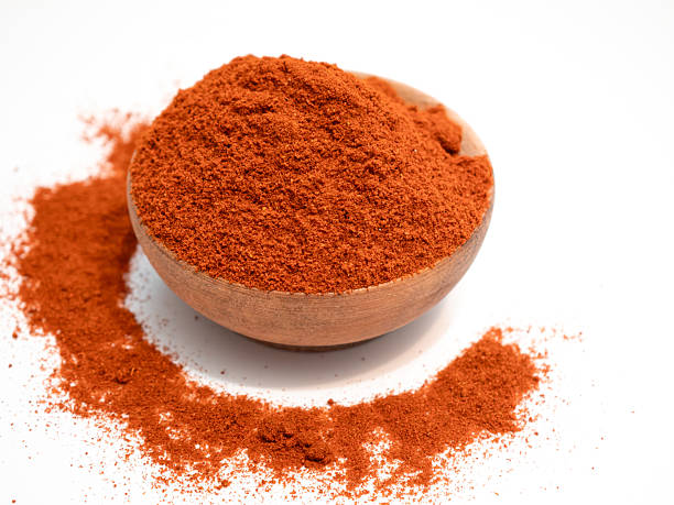 istock Cayenne pepper ground orange spice powder close up 2232816782