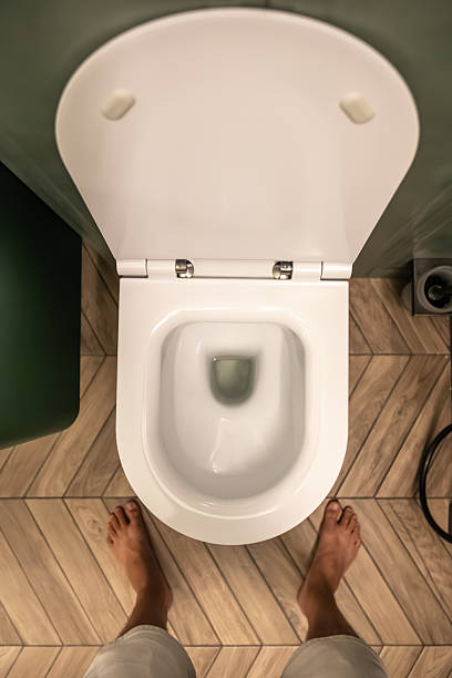 istock Person over toilet. Modern bathroom design. Top view 2232818019