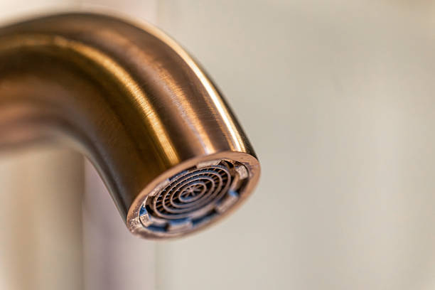 istock Aerator closeup. Copper glow. Modern faucet. 2232818022