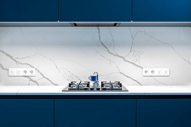 istock Gas stove closeup. Marble wall. Sleek modern kitchen interior. 2232818303