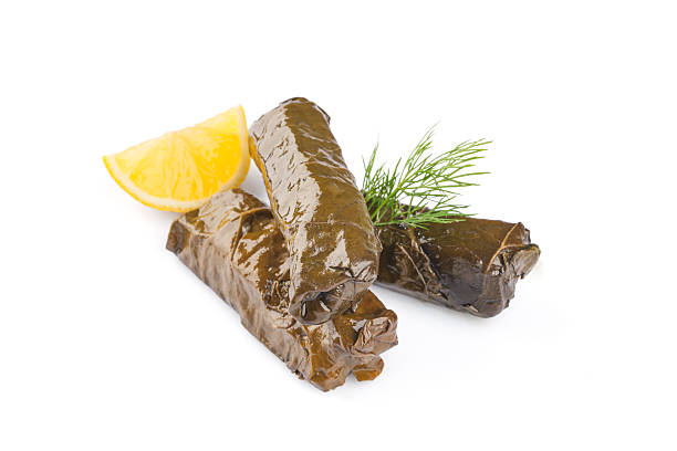 Delicious Turkish dish, stuffed vine leaves, on a white background