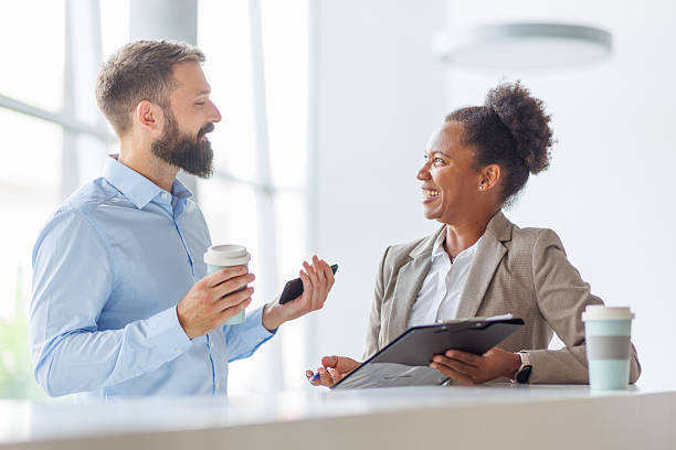 istock Business people chatting during coffee break in office 2232823629