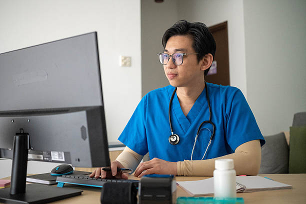 istock Experienced Doctor with Stethoscope Studying Health Reports 2232824463