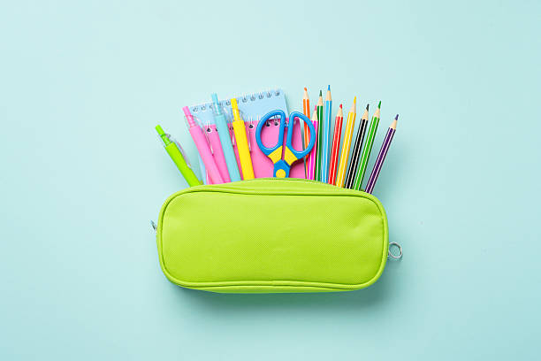 istock Pencil case with stationery on blue background. 2232824964