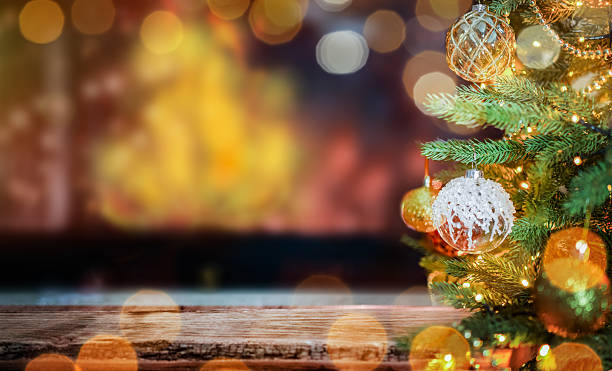 Christmas Tree with Ornaments and Festive Lights by the Fireplace