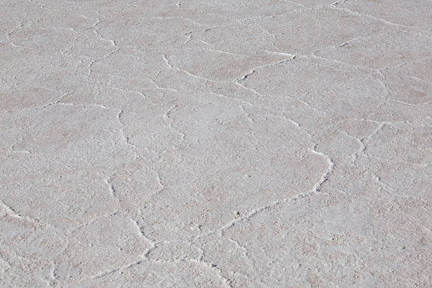 White salt salt covering ground creating unique textured surface with cracks in Tuz Golu, Turkey.