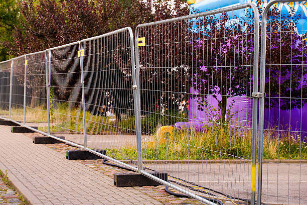 istock Temporary metal fence on a sidewalk 2232837366