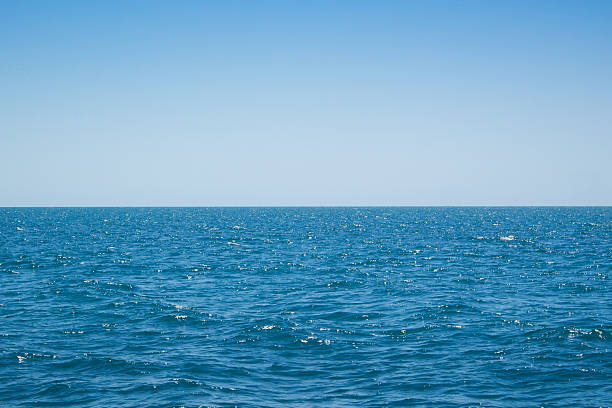 istock Minimalist Ocean Horizon with Clear Blue Sky 2232839039