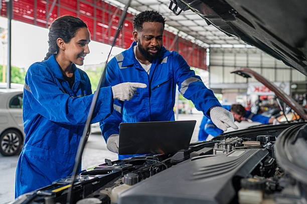 istock Team Auto mechanic are checking and repair maintenance auto engine 2232839165
