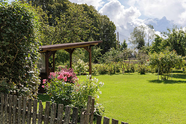 istock Idyllic Garden View with Wooden Gazebo 2232839930