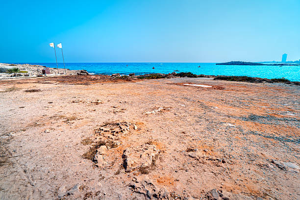 Mediterranean coast of island, Nissi Beach in bay with white sand and turquoise water, Cape Greco, Cyprus.