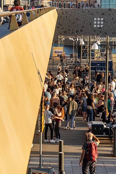 Stockholm, Sweden July 4, 2025 People dancing outdoors in the summer sunset in the Slussen district.