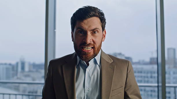 istock Portrait furious ceo shouting at office windows. Angry mad boss looking camera 2232843832