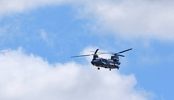 Two US Air Force Boeing CH-47 Chinooks from the 101st Airborne Division leaving the scene of an air attack demonstration commemorating Operation Market Garden in The Netherlands