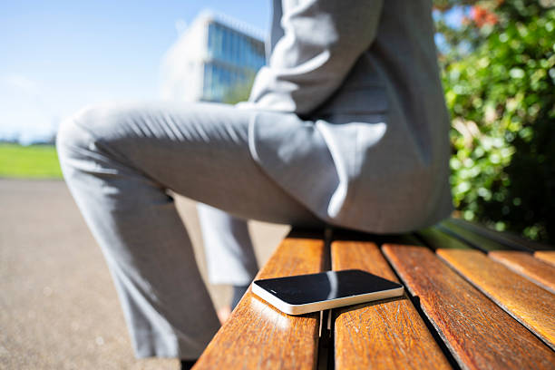 istock Businessman forgetting smartphone on bench 2232848995