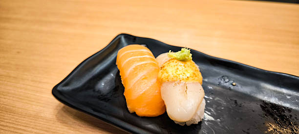 istock Sushi on a black plate Japanese food 2232852088