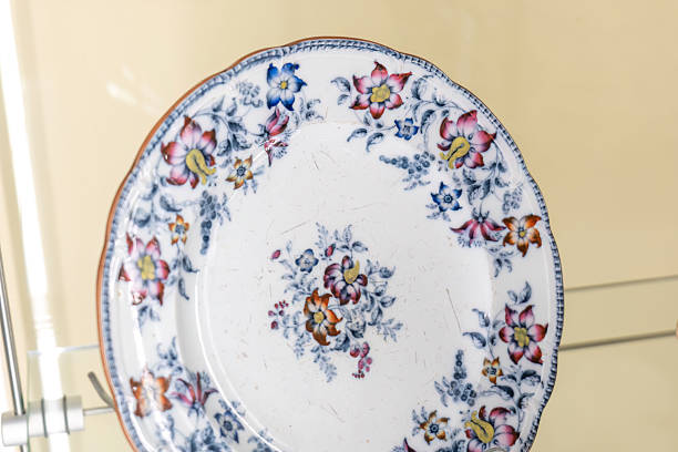 istock Antique porcelain plate with colorful floral decorative ornate patterns on display, single object, vintage ceramic tableware dish, elegant decorative cultural heritage collection closeup, no people 2232852777