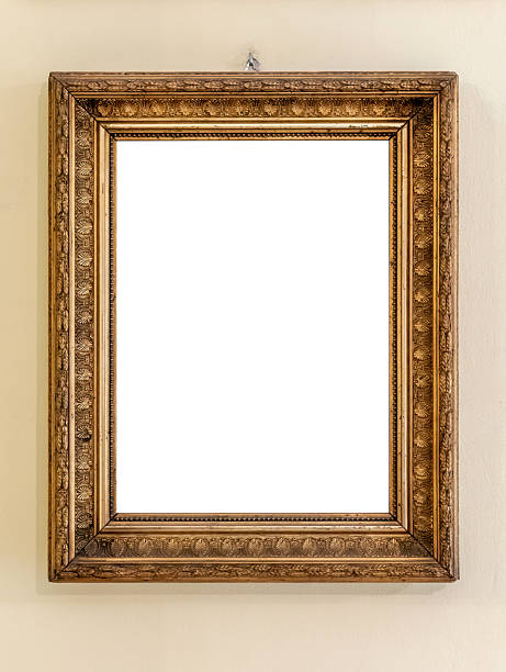 istock Ornate antique gold picture frame hanging on wall with blank empty cut out white interior for artwork copy space, vintage decorative baroque border mockup front view on museum gallery home wall, front 2232852839