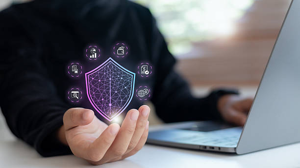 istock Businesswoman holding digital shield icon for financial data protection, representing cybersecurity, digital banking safety, and fintech transaction security. 2232853844